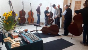 an image of Double Bass players trying out instruments at Bass Day 2020